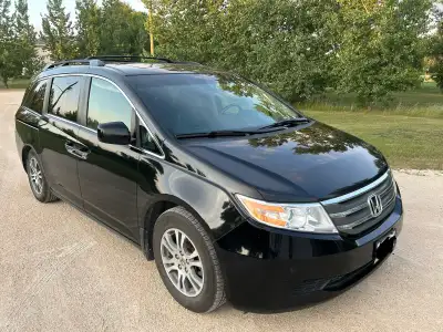 Freshly safetied, 8 passenger Honda Odyssey EX-L van. Leather seats, CD player, AM/FM radio, DVD pla...