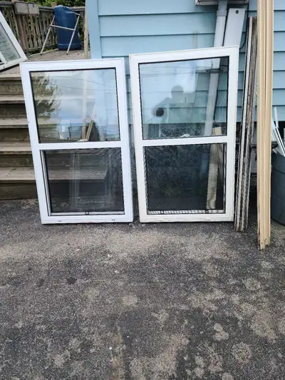 2 used vinyl windows. Style single hung tilt. Size 1 at 28 3/4"× 48 3/4". 1 at 29 1/2"× 48 1/8". Col...