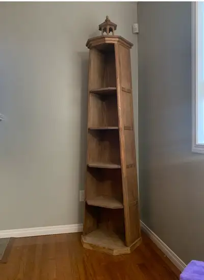 This lighthouse shelf is a charming piece that stands tall, offering a unique way to display your fa...