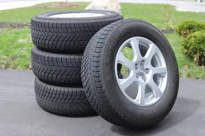 Tires: Michelin X-Ice Snow SUV Size: 235/65R17 Made in Canada DOT 4525 — manufactured in the 45th we...