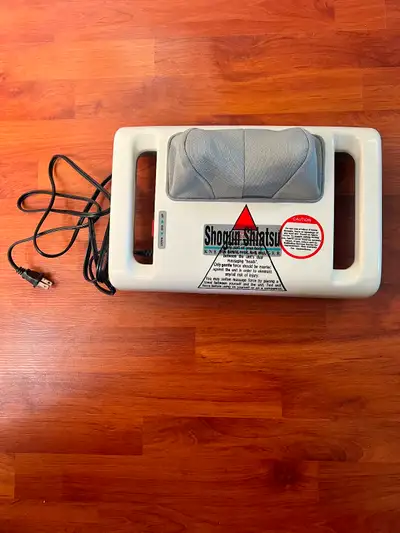 HOMEDICS Shogun Shiatsu Family Massager. Features two mechanical kneading thumbs that simulate a rea...