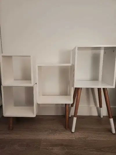 A set of white shelving units , View more