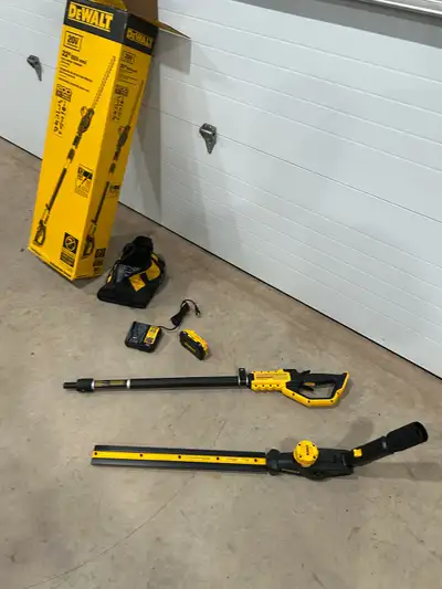For sale one Dewalt 22” pole hedge trimmer (DCPH820B) still in box used once for an hour. Also comes...
