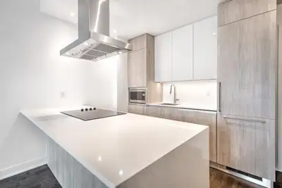 Bright and modern 1-bedroom condo at Le Drummond Phase 2, southwest-facing on the 9th floor with spe...