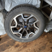 Four all season tires on rims for Subaru Crosstrek