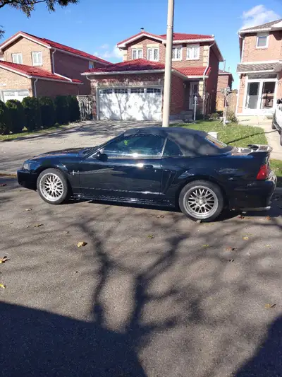 I'm selling my 2002 Ford Mustang Convertible, a sleek black beauty with an automatic transmission an...