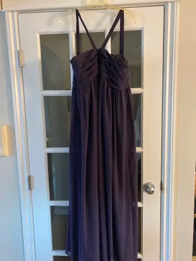 Was worn as a bridesmaid dress just once. The designer is Bill Levkoff. Size 22 but fits just a bit...