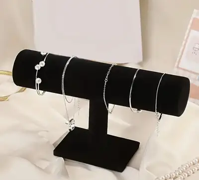 Here's a black velvet jewelry display stand in great condition! It's perfect for displaying bracelet...