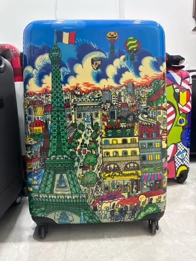 Embark on your next adventure with this eye-catching Heys hard-shell luggage, featuring a vibrant Pa...