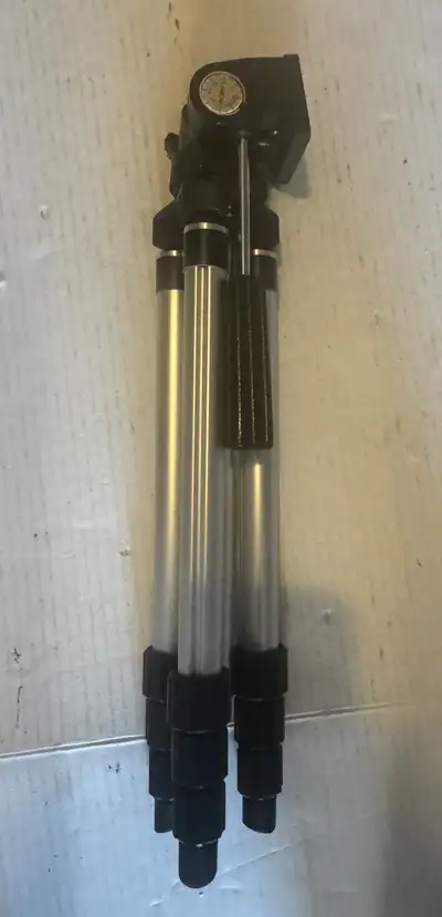 This is a used Meikai tripod, perfect for photographers on the go. It's lightweight and compact, mak...