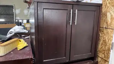 Dark wood storage cabinet / credenza in good used condition. Practical office, shop, showroom or hom...