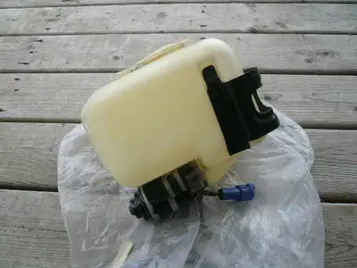 1982-1985 Toyota Supra Windshield Washer Bottle, Pump & Bracket. In very good condition.