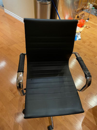 Sleek metal computer chair with wheels 