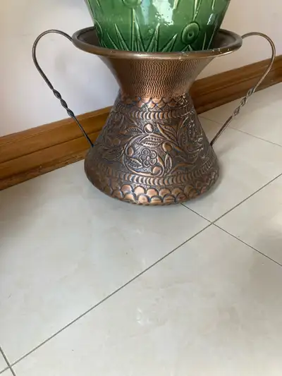 Ornate antique copper stand with handles. Great for adding a touch of nature to your home. Plant not...