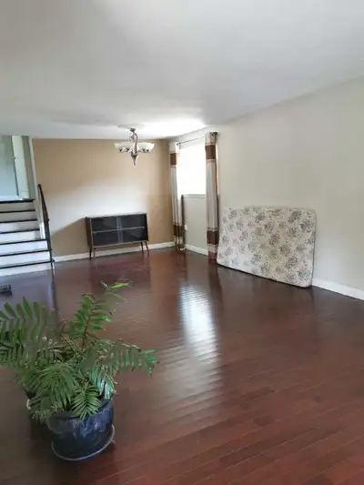 Spacious three-bedroom unit on the first and second floors, featuring 1 bathroom, separate living an...
