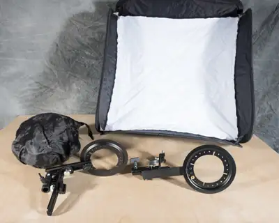 Am selling 2 - 24x24" foldable softboxes with adjustable brackets to mount speedlites. The ring from...