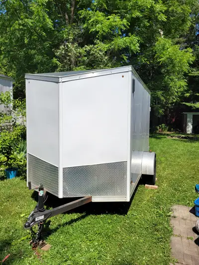 2018 6 x 10 Enclosed trailer with barn door rear doors and side door. White, single axle, used for l...