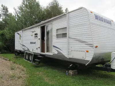 39' 2 bedroom, 1 tipout works, patio door, new fridge electric, air conditioning, everything works a...