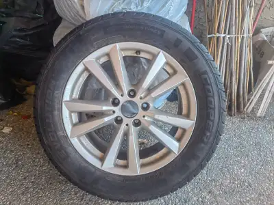 Genuine BMW factory wheels with used 255/55R18 tires. Approx. 1/4" (~6 mm) tread remaining, even wea...