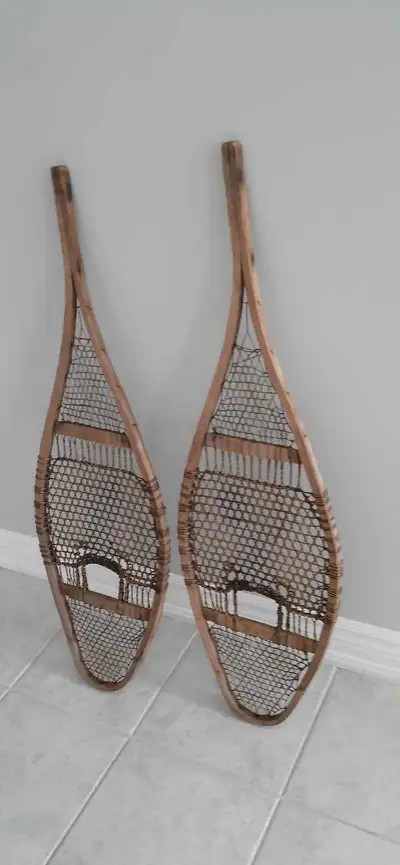 These are a pair of vintage snowshoes in used condition, perfect for decoration or collecting. These...