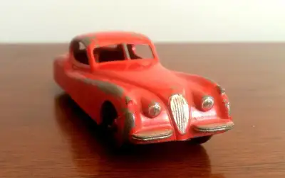 DINKY TOY DIECAST #157 MADE BY MECCANO 1954 TO 1962 JAGUAR XK120 RED BODY WITH RED RIDGED WHEEL HUBS...