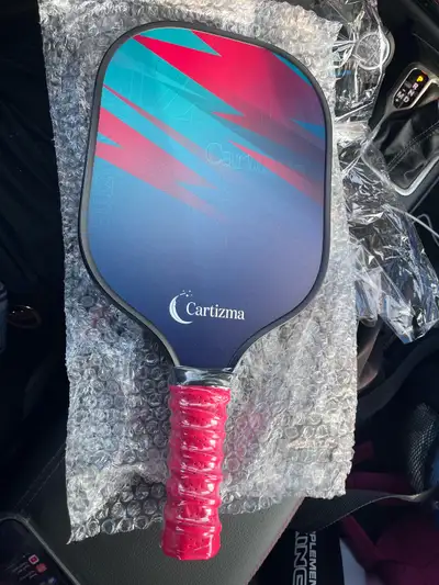 This BRAND NEW Cartizma pickleball paddle set comes complete with everything you need to hit the cou...