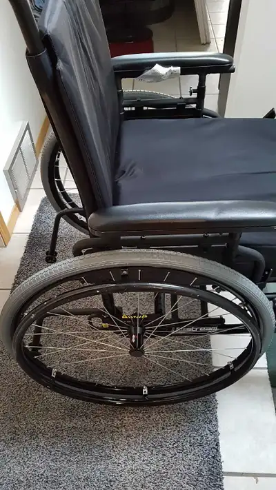 This Pride Litestream XF lightweight wheelchair comes with a Blake Medical Hybrid Deep Cushion and a...