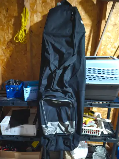 Nylon black golf travel bag. Not used very much. Very durable.