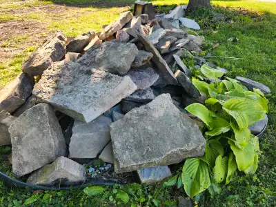 A large assortment of stones perfect for a garden edge or rock garden. Some will make nice steps if...