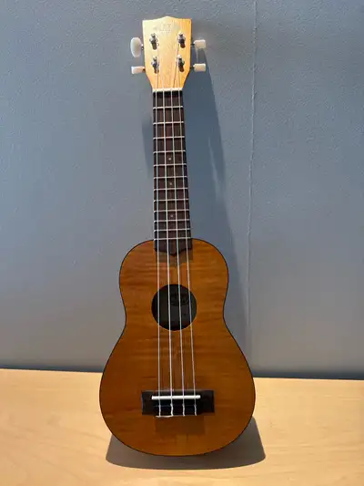 I'm selling a used Kala KA-SEM soprano ukulele, featuring beautiful exotic mahogany for a rich, vibr...
