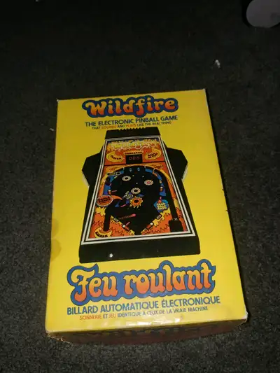 Wildfire pinball machine electronic working with battery cover and box and an Old Miss Pac-Man broch...