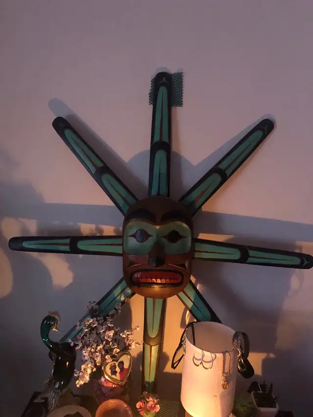 Native art carving of a sun mask 62863258312195121