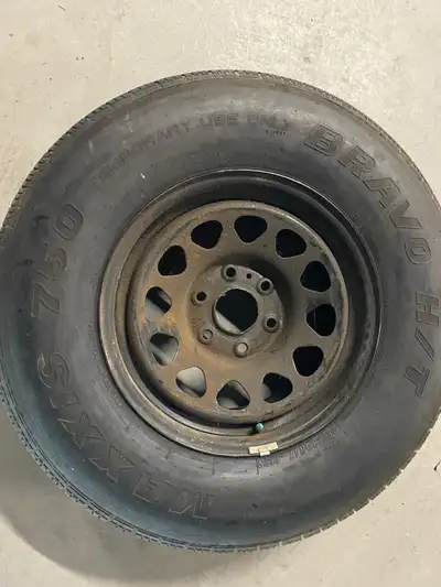 Brand new never used GMC Truck wheel 6 bolt rim and 255/80R tire Been oiled since new