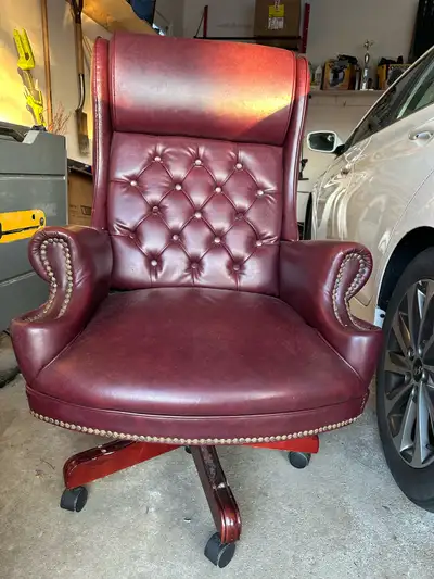 Red leather office chair with decals, heavy good quality. Does have some signs of wear as pictured b...