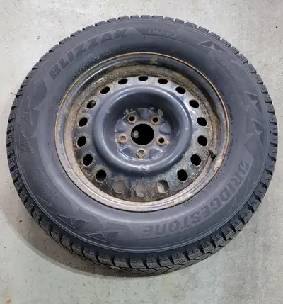 Set of four Bridgestone Blizzak DM-V2 winter tires (P235/70R17) Tread depth remaining is approximate...