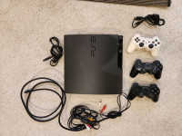 Playstation 3 with three controllers, games and movies