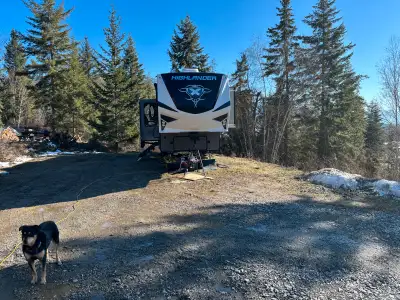 2020 highlander 5th wheel trailer with 3 slides, the back door folds down to be a deck with a pop up...