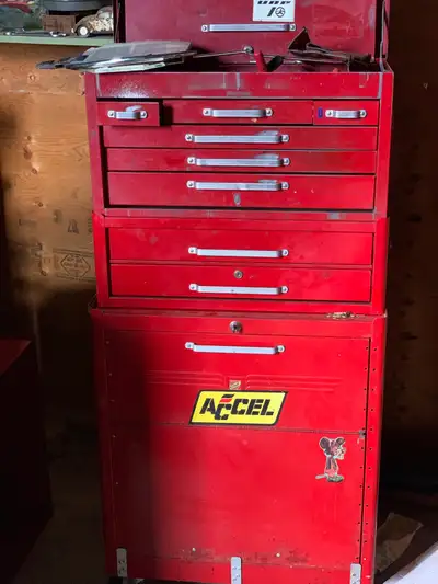 Nice older beach toolbox with a pile of tools
