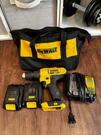 Dewalt drill charger 2 batteries and a carrying bag 