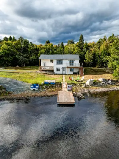 This beautiful and lakefront 2 Bedroom (lower) unit on ground floor lies within a beautiful waterfro...