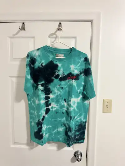 Looking to sell this Guess Originals tie-dye t-shirt! It's a size medium and features a cool green a...