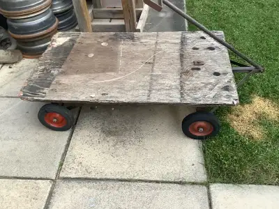 Hand made platform wagon, top 46.5 x 283/4, hand pull is 33 inches, on 3/4 plywood, metal frame for...