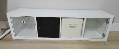 Like new condition IKEA KALLAX shelf storage unit with door/glass shelf inserts and two new metal st...