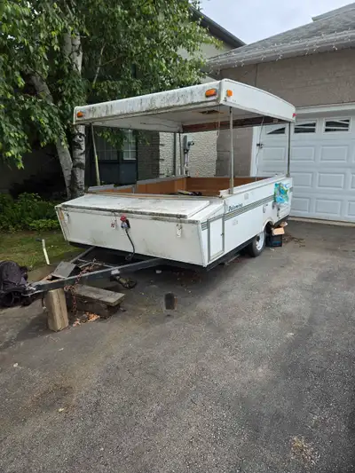 Gutted pop up trailer. Solid frame, leaky roof. Perfect for a utility trailer. All lights work. Has...