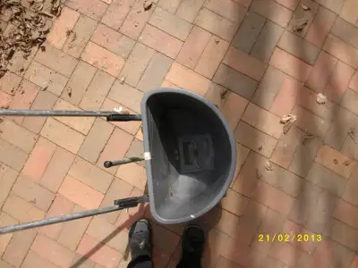 Holds up to one bag of fertilzer