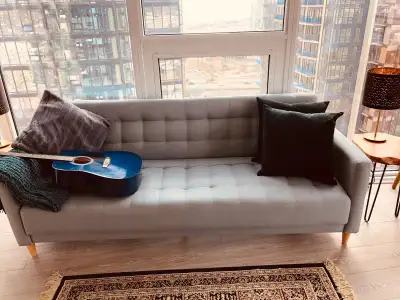 Light heather gray/green couch with biscuit tufting, View more