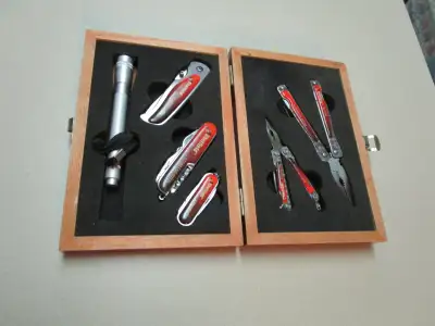 3 Multi-tool pocket knives , like new 2 multi-tool pliers , like new penlight flashlight does not wo...