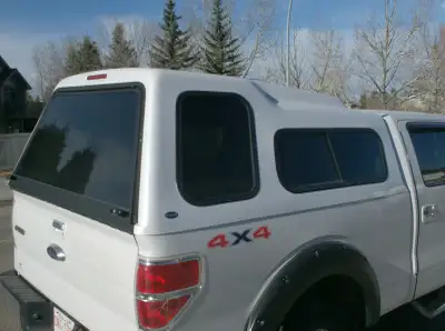 White high top canopy, excellent condition, 6 ft 6 in box, tinted 50/50 side sliding windows, tinted...