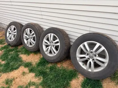 1 season old Plenty of tread left Bridgestone summer tires 215/65R16 98H Stock rims