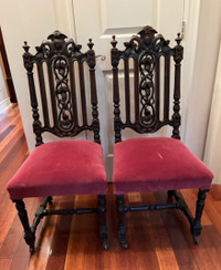 Two English oak Jacobean carved chairs.